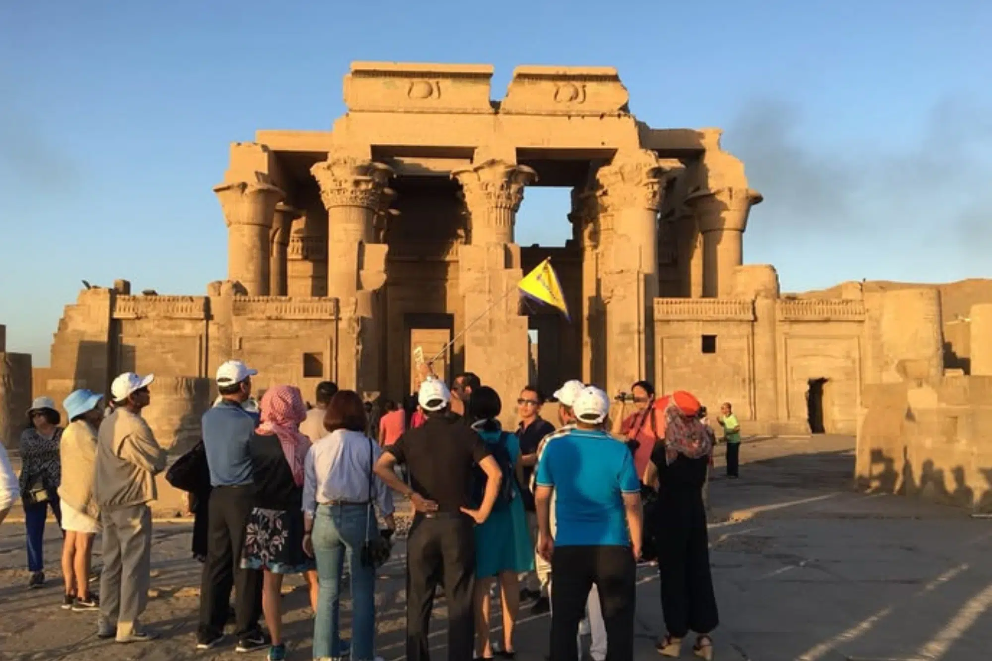 Licensed Egyptian tour guide explaining ancient history at a historic site