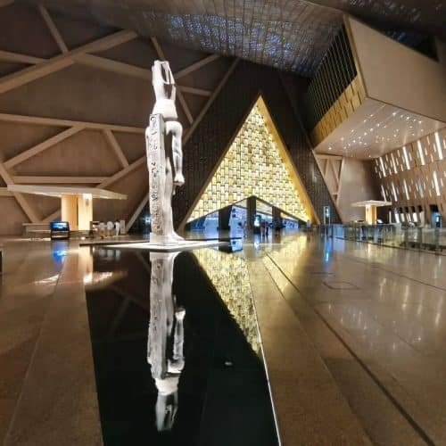 Grand Egyptian Museum tour Cairo with Egypt Unlocked guide at GEM entrance