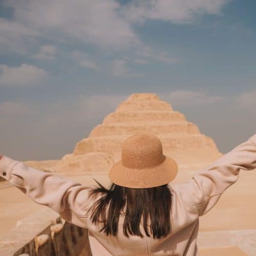 A girl standing in front of Saqqara pyramid