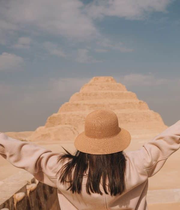 A girl standing in front of Saqqara pyramid