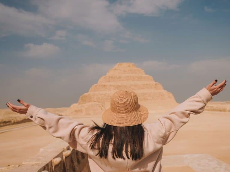 A girl standing in front of Saqqara pyramid