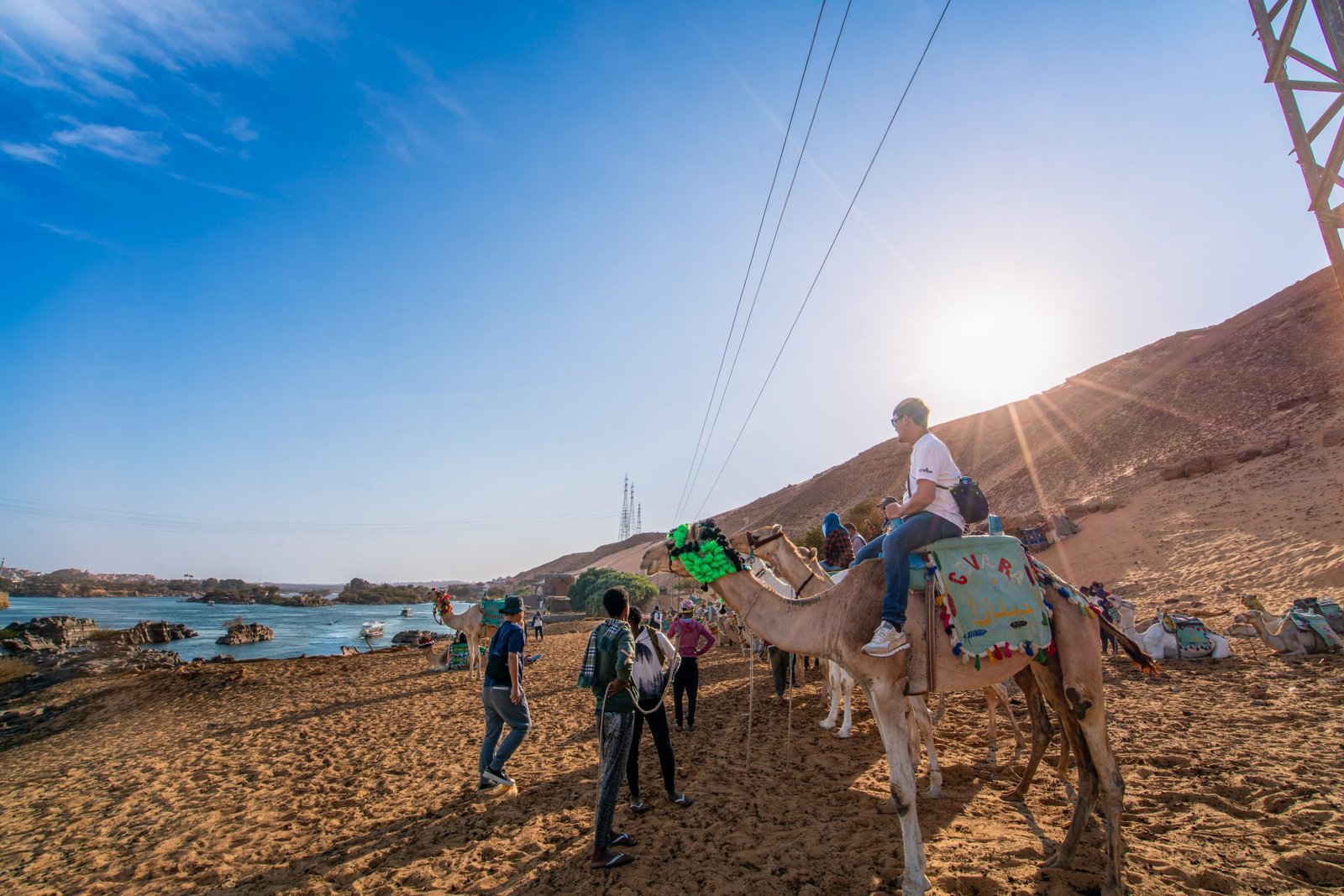 Aswan,Dam,,Egypt,-,January,15,,2025:,Tourists,Ride,Camels